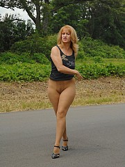 Lady Sammi in pantyhose on an outdoor road